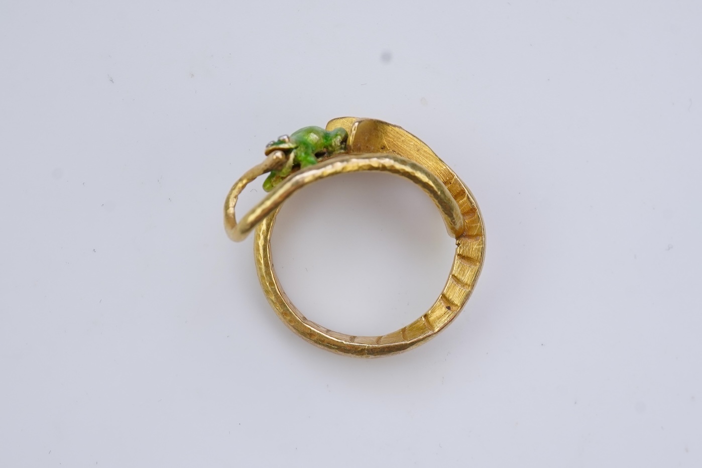 An unusual gold and enamel novelty ring